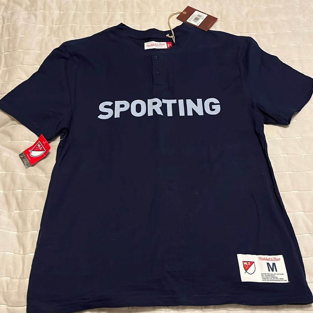 Mitchell & Ness Sporting Kansas City 3 button T-shirt.